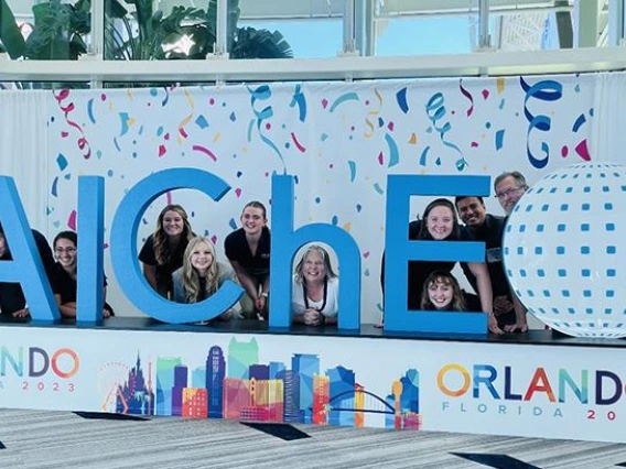 Univ. of Arizona CHEE students standing in front of AICHE sign