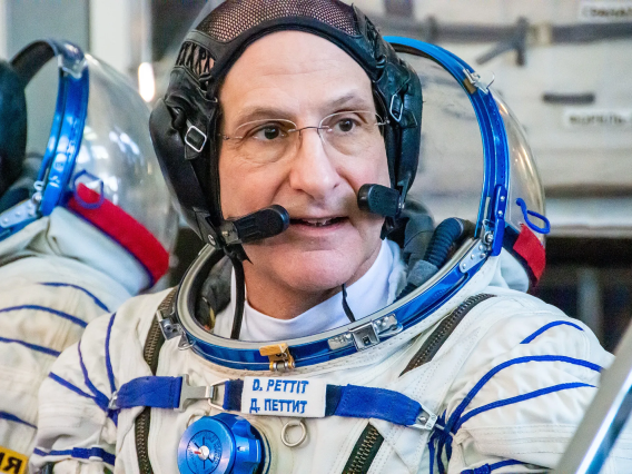 A headshot image of NASA astronaut Don Pettit wearing a launch and entry suit during crew qualification exams at the Gagarin Cosmonaut Training Center.