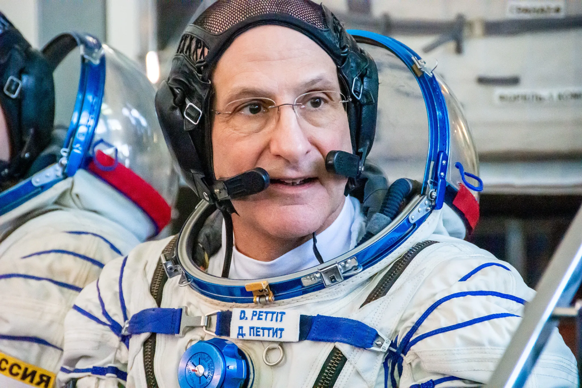 A headshot image of NASA astronaut Don Pettit wearing a launch and entry suit during crew qualification exams at the Gagarin Cosmonaut Training Center.