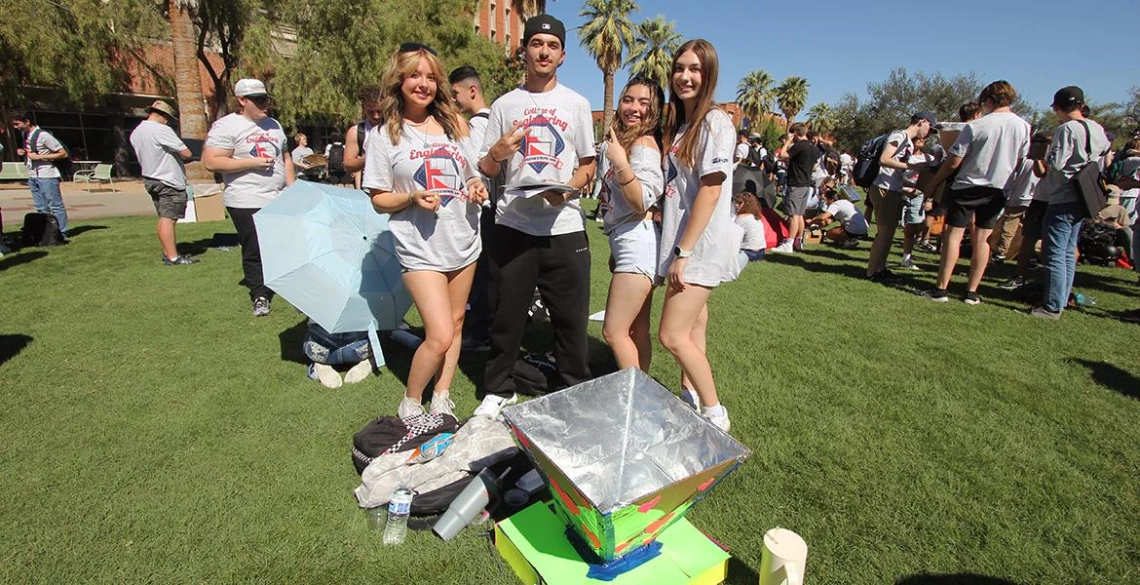 (From left) First-year students Grace Cornelius, Karam Alshammari, Danniella Martinez and Cameryn Black from Team Animal Crackers use recyclable materials to cook biscuits at the University of Arizona Mall.