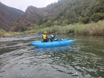 two people in canoe on river