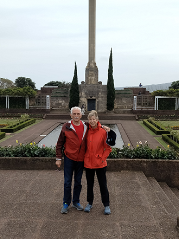 two people standing in front of monument
