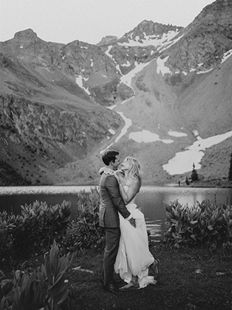 man and woman in front of mountain