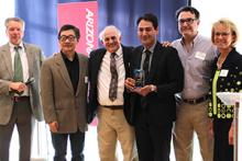 The MetOxs team accepts their I-Squared award