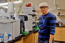 Mojtaba Azadi Aghdam runs samples on a mass spectrometer in Shane Snyder’s lab.