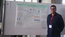 Francisco Martinez standing in front of his research poster