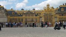 The gold-covered Palace of Versailles from the courtyard