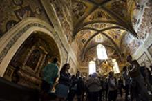Study abroad students gaze at frescos alongside other visitors inside the Duomo di Orvieto in Orvieto, Italy, on May 27, 2016. Photo by Alex McIntyre/The Daily Wildcat