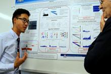 Wu discusses his research at a poster presentation; Image courtesy of the UA Undergraduate Biology Research Program