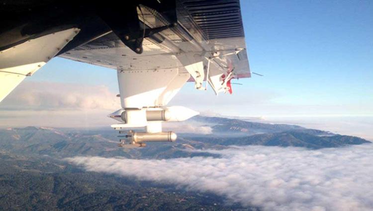Photo taken from inside an airplane flying above the cloud layer.
