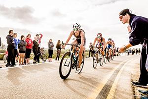 Erica Clevenger leading a pack of cyclists; photo by Jimmy Song Photography