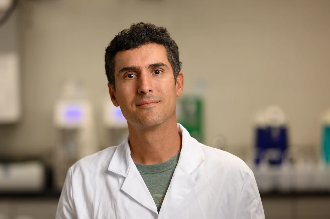 A man in a white lab coat.