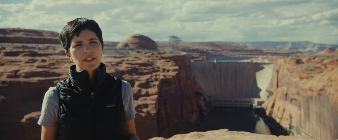 Kerri Hickenbottom stands in front of the Hoover Dam in the documentary "Flowing Forward: “Shared Water"